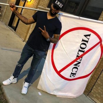 KWOE Passing with No Violence Flag on Westside